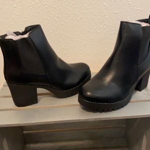 NIB black faux leather platform booties.
